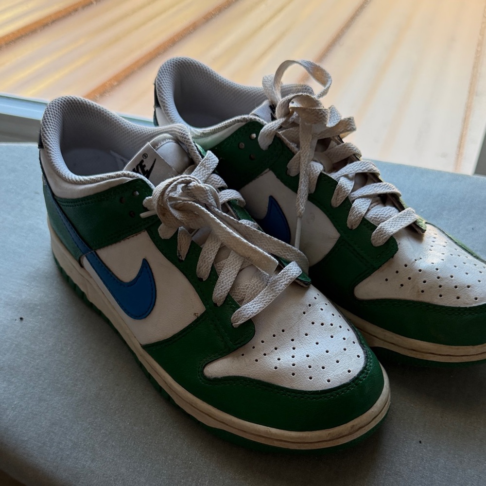 Green and White Nike Sneakers with Blue Accents